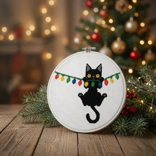 Christmas Black Cat Hanging from Lights Counted Cross Stitch Pattern